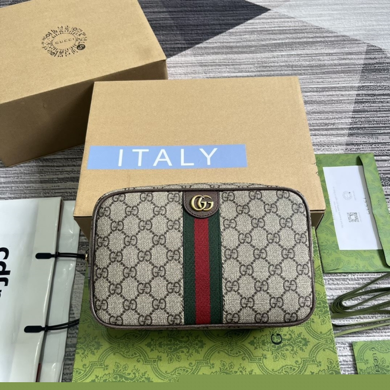 G*u*i clutch bags